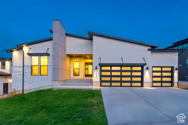 Ready to move in! The Evan's Modern plan is an expansive rambler with an ideal layout for main floor living. The covered entry with open landing reveals a welcoming foyer and view of the soaring great room and dining room with floor to ceiling windows. The well-designed kitchen is equipped with a large center island with breakfast bar, plenty of counter and cabinet space along with a generous walk-in pantry. You'll be living in luxury with all JennAir appliances! The stunning primary bedroom suite is complete with a private covered patio, enormous walk-in closet and deluxe primary bath with dual vanities, large soaking tub, luxe glass-enclosed shower and private water closet. Secondary bedrooms feature walk-in closets and shared full bath with double sinks.