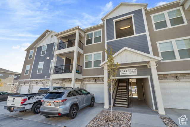 Stunning top-floor condo at The Exchange in Lehi! This exceptional home boasts an open-concept living. The kitchen and bathrooms are enhanced with elegant granite countertops. You'll love the generously sized bedrooms, including a luxurious master suite with a spacious walk-in closet. Step outside onto the walk-out porch to enjoy breathtaking southern views. This condo combines style, comfort, and convenience in one of Lehi's most desirable communities!