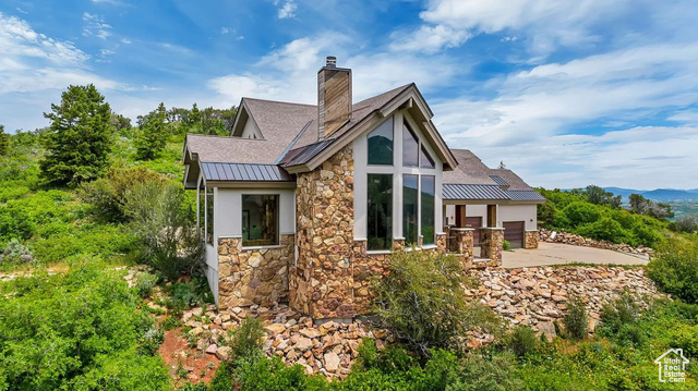 Rear view of property with a patio area