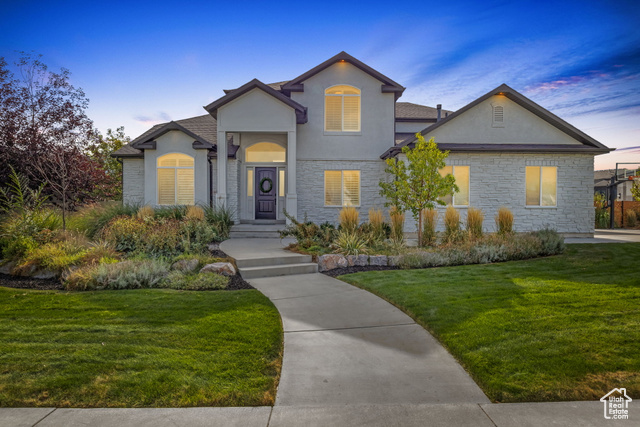 View of front of home featuring a yard