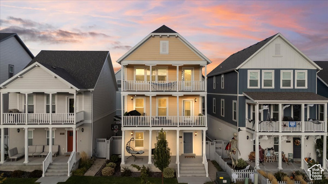 View of front of house featuring a balcony