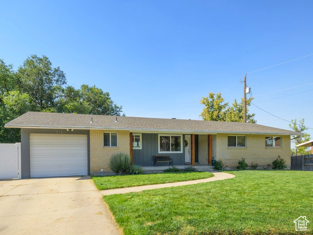 Ranch-style house with new wood columns and a front porch to set and enjoy the view.