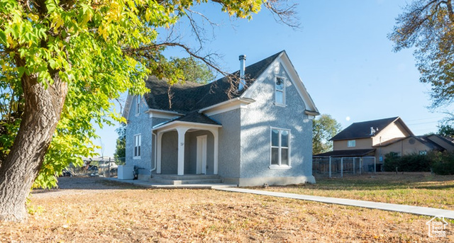 View of front of house with cooling unit