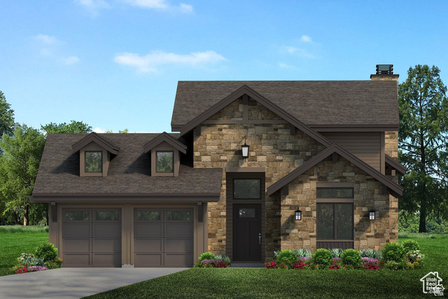 View of front of house featuring a front lawn and a garage