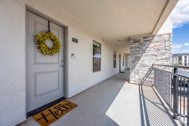 Doorway to property featuring a balcony