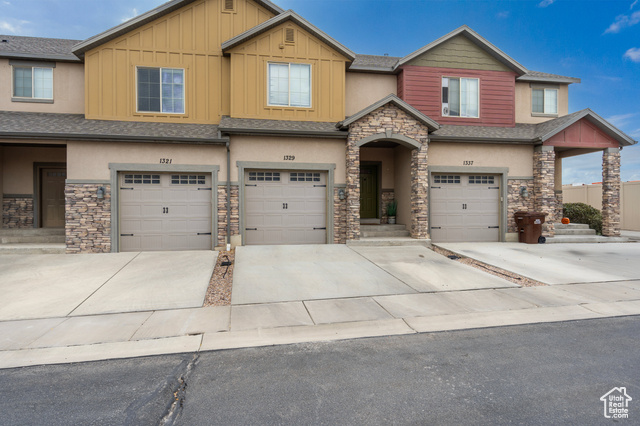 View of front facade featuring a garage