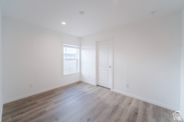 Empty room featuring light hardwood / wood-style flooring