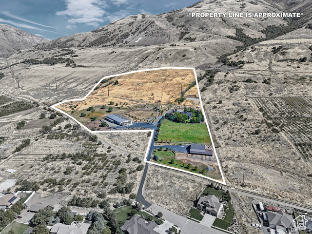 Birds eye view of property with a mountain view