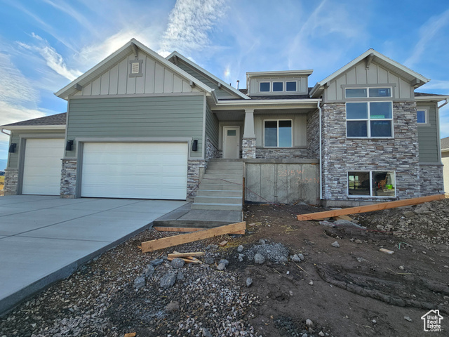 View of front facade featuring a garage