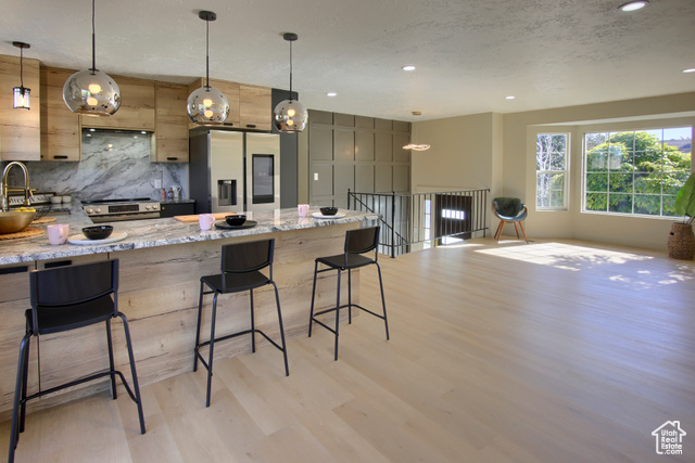 Great Room with luxury kitchen and tons of natural light.