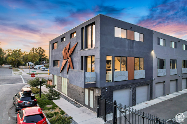 Property exterior at dusk with a garage