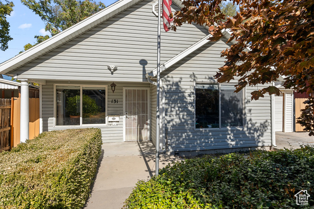 View of front of property, very little yard maintenance.