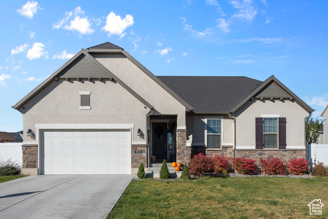 View of front of property with a front lawn