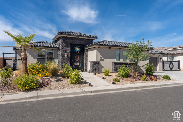 Mediterranean / spanish-style house featuring a garage