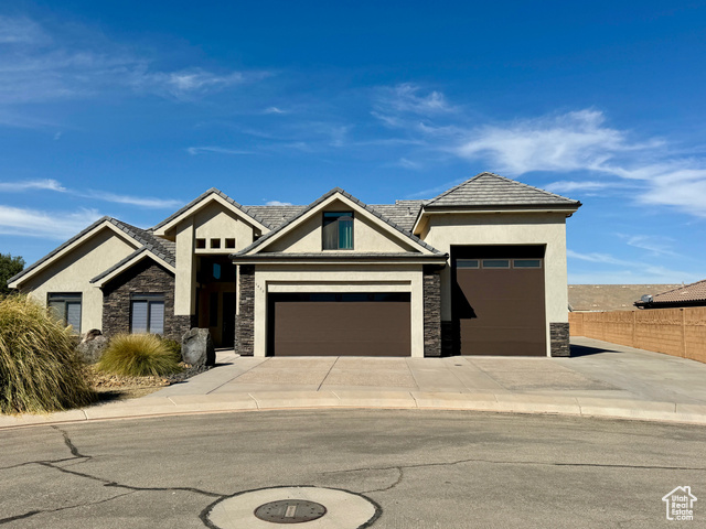 View of front facade featuring a garage