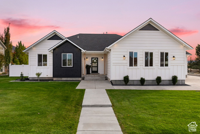 View of front of property featuring a yard