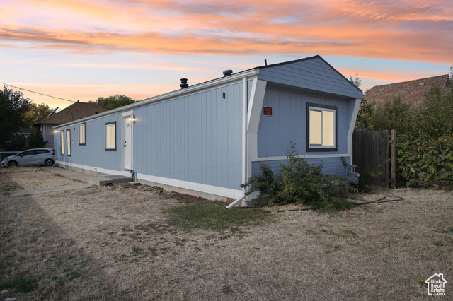 View of property exterior at dusk