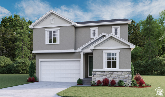 View of front of home with a front lawn and a garage