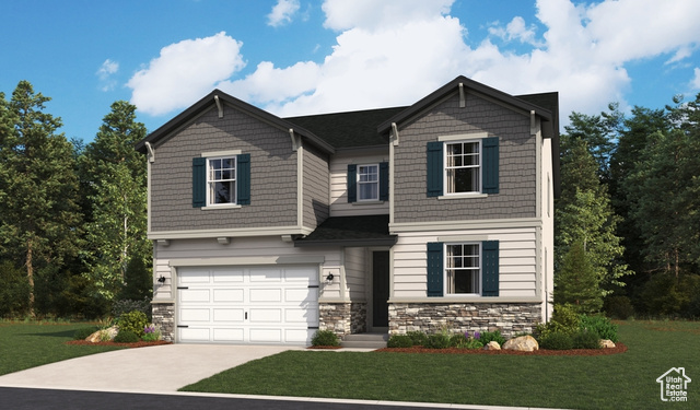 View of front of home with a front lawn and a garage