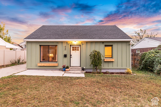 View of front of property featuring a yard