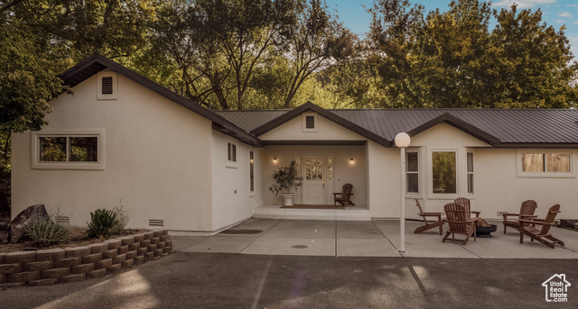 Back of property featuring a patio area