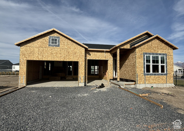 Property under construction with a carport