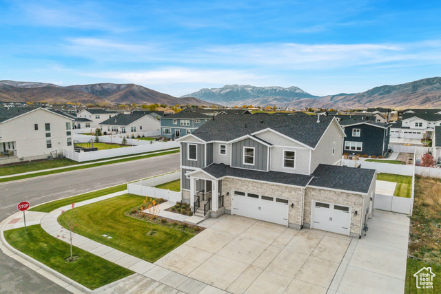 Gorgeous like new home on a quarter acre corner lot with mountain views! No need to build just move right in! This home features a great open floor plan on the main level with a large great room with fireplace and tons of windows to enjoy the views of Mt. Timpanogos! Amazing kitchen with large island, two ovens, and gas range and nice sized pantry! Upstairs is a loft area, 2 guest bedrooms and large shared bathroom and spacious primary suite with views and awesome bathroom with glass shower and large tub.  Then downstairs is a full kitchen, living room,  one bedroom and full bathroom with its own private entrance and fenced off patio and yard! Perfect to rent out short or long term or for guests to use when visiting.  The 3-car garage has a wall in between the 2-car side and 1-car side so if you do rent out the downstairs they get a private garage space.  The large backyard has a dog run area and 2 patios.  This home is close to the many schools and only 12 minutes to new East Village at Deer Valley and Jordanelle Reservoir.  30 minutes to Park City and 15 minutes to Sundance Resort.  The Heber Valley is an outdoor oasis, and this is the perfect home base!