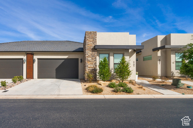 View of front facade featuring a garage