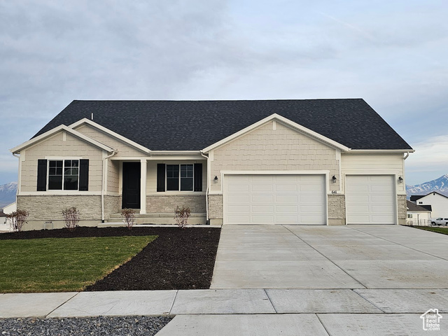 View of front of property featuring a front lawn and a garage. Picture is of a Helena but no the subject property.