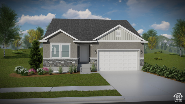 View of front facade with a front yard and a garage