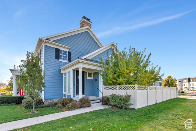 Charming Daybreak townhome showcasing pride of ownership and location location location!  Large spacious grass yard fully maintained.  Walk across the street to embark on the Daybreak Lake and the miles of trails.  The jewel of Daybreak is the Oquirrh Lake, its beaches and the pier on Northshore.  Short walk to the Northshore grocery shopping and dining.  Formal Living Room with vaulted ceilings and large windows allowing for abundant natural lighting! Hardwood flooring connects Great Room to dining and kitchen with island, custom tile backsplash, chic lighting, and rich cabinetry with crown molding. Primary Bedroom Suite is on main floor and includes en suite bath with double sink vanity, standing euro shower and tile flooring! Upstairs living space is complete with 1 bedroom, 1 bathroom and a flex space overlooking the Living Room which can be used as a home office, study space, exercise room and more!  Expansive downstairs Family Room offers ample space for entertaining, craft or Home Office.  Enjoy the private fenced patio enveloped by greenery, perfect for peaceful outdoor gatherings. This home offers comfort and convenience in the ideal Daybreak location.  Don't miss the chance to make it yours!