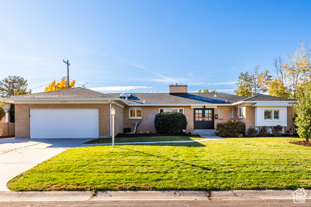 Recently updated, this home features a brand-new roof with solar panels, fresh interior paint, a recently remodeled bathroom, an updated kitchen, new carpet, and a spacious layout with three large bedrooms upstairs. The home also includes a generous family room and a semi-formal dining area adjacent to the kitchen. The updated kitchen boasts a large peninsula, perfect for dining, homework, or both, as well as stainless steel appliances, a gas stove, double wall oven, farmhouse sink, and granite countertops. With a full, walkout basement and a second kitchen, this flexible layout is ideal for anyone needing extra space, hosting guests, or day-to-day living. The two-car garage includes dual EV chargers, additional storage, and a mudroom entry. The fully fenced backyard showcases stunning mountain views, a playground, an in-ground trampoline, and excellent privacy. Enjoy the convenience of nearby schools and amenities, including the new Millcreek Commons, parks, hospital, and access to trails and canyons. Millcreek is perfectly situated for easy access to Downtown, the Salt Lake International Airport, and Park City resorts.