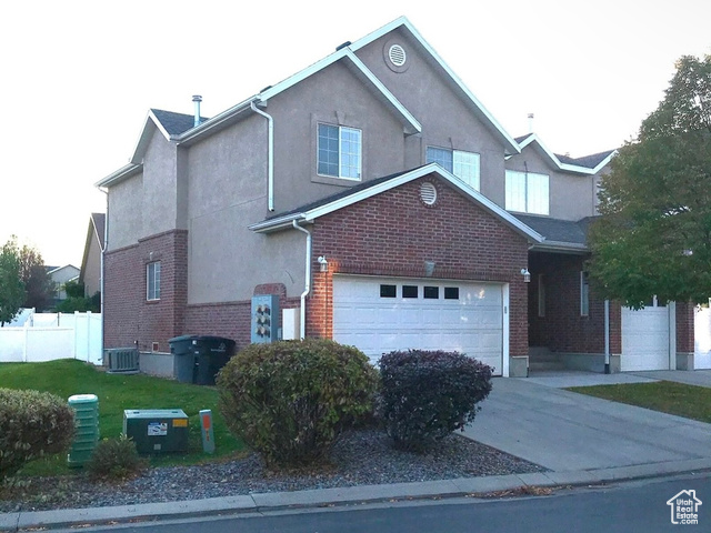 Welcome home to this spacious, 2-car, row-end townhome with fully finished basement and gated backyard in the desirable Bluffs community! Located in prime South Jordan area near stores, parks, and The District. Pristine condition, remodeled throughout with new two-tone paint and carpet and many upgrades: granite kitchen and bathroom countertops, modern vessel sinks, fountain faucets, new bathroom lighting, marble-look vinyl flooring, new window blinds, built-in electric fireplace, wall wood paneling, modern backsplash, new stainless steel stove and fridge. Kitchen and bathroom feature real knotty alder wood cabinets. Fully finished basement can be a second family room, game room, office or guest area. Gated, quiet, private backyard opens to a grassy area great for walking or playing. Enjoy outdoor playground and swimming pool in the summer. Up to two pets are welcome. Air duct system has been professionally cleaned to be ready for a new owner. Low HOA monthly fee and maintenance-free living!