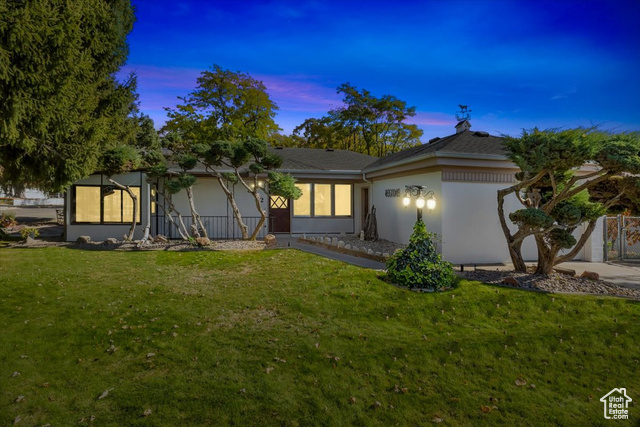 View of front of house featuring a lawn