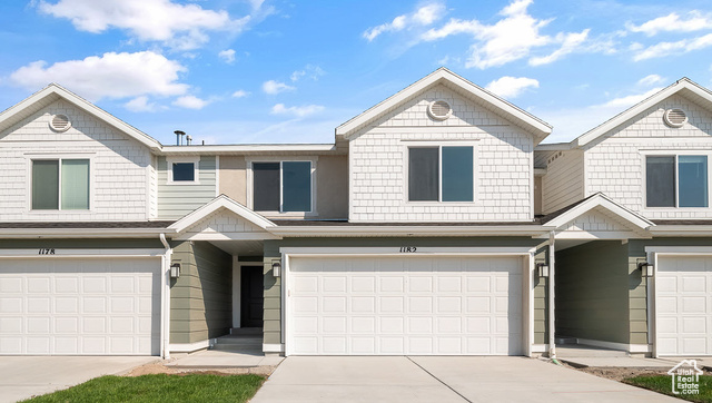 View of front of property with a garage