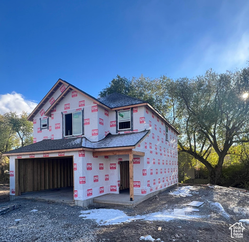 Property in mid-construction featuring a garage