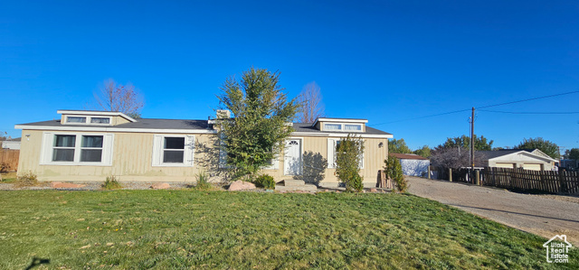 View of front of property featuring a front lawn