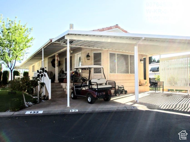 Exterior of home featuring a carport