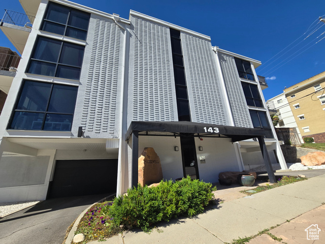 View of building exterior with a garage