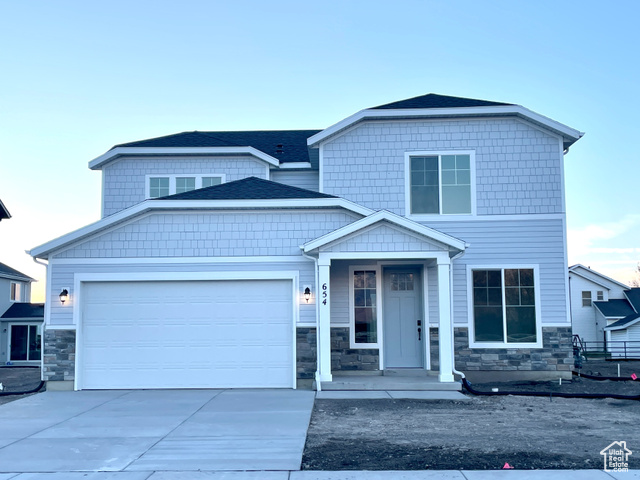 Craftsman-style house featuring a garage