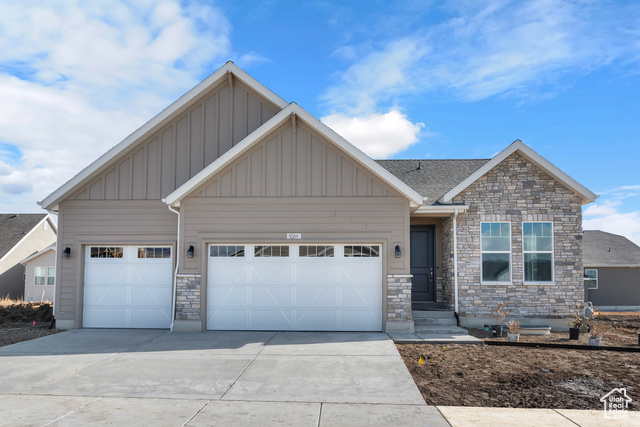 Craftsman-style house featuring a garage