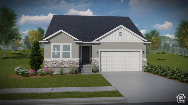 View of front of property featuring a garage and a front yard