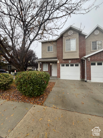 View of property featuring a garage