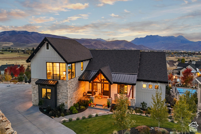 Modern farmhouse style home with a yard and a mountain view