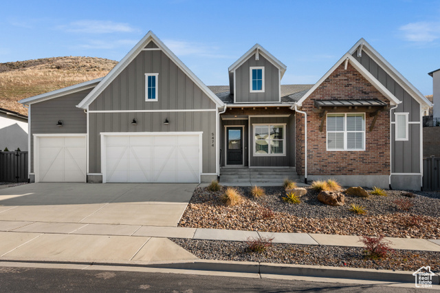 View of front of property featuring a garage