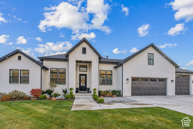 View of front of house with a front yard