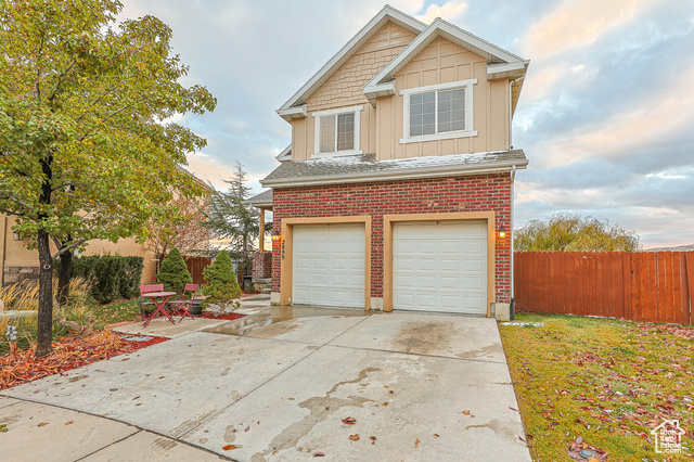 View of front facade featuring a garage