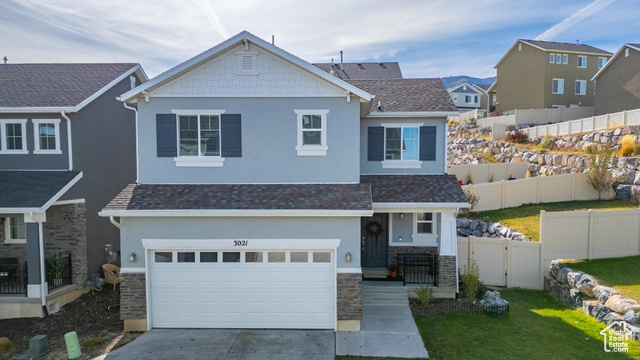 View of front of home featuring a garage