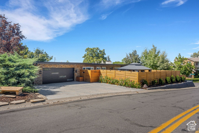 View of front of property featuring a garage