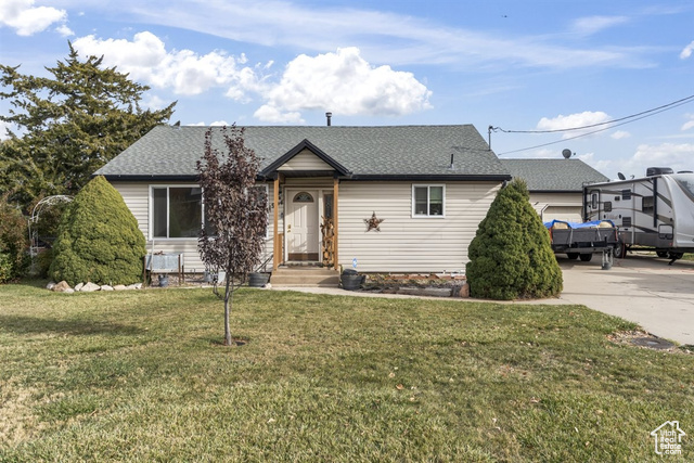 View of front of property with a front lawn